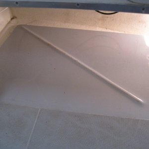 Raised floor that supports center of tank.