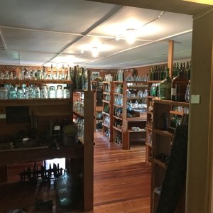 A room of old bottles at Billy Procter Museum near Echo Bay