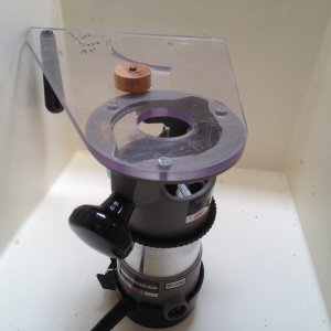 Media 'We\'ll use a router with a spiral upcut bit to make the hole. Luckily I have a multi-purpose router base and with a wooden plug to fit the existing hole, it will guide the circle cut.' in album 'The problem: Under the plastic cap there\'s water in the space below the cabin floor, and the foam is soaked. An access port will be needed.'