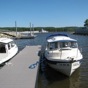 Tow barge passing marina