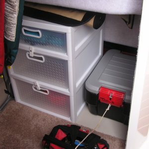 "Cave": removed cushions, added storage drawers with keep-closers, containers for tools and repair supplies