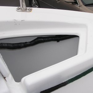 Media 'Anchor rode well with lid open, added two plastic clips to hold trailer wiring harness away from the rode' in album 'Added liner inside portside cock pit storage to protect wiring, etc. Shown is outboard motor mount for swim step'