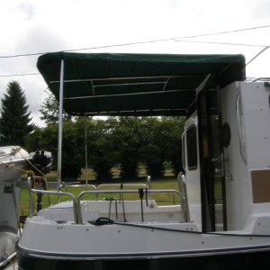 Canvas canopy over rigid stainless with bug netting for side panels
