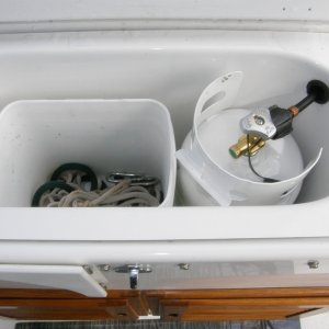 Converted baitwell to propane locker with venting and storage
