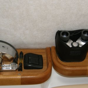 Captain's binoculars in secure pouch. Bubble level to help side to side trim