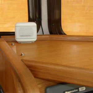 Media 'External speaker for everyone to hear the VHF' in album 'Added liner inside portside cock pit storage to protect wiring, etc. Shown is outboard motor mount for swim step'