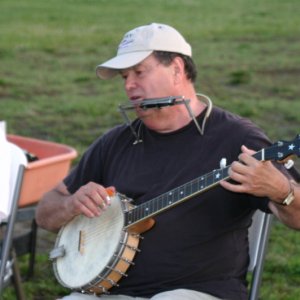 Tom McHugh on the banjo and harmonica