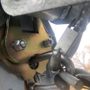Photo from below shows the latch closed around towing eye on boat.
