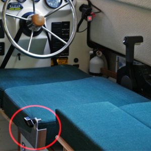 Media 'Closer look at the quick release arrangement' in album 'Port and Starboard Beds looking aft. The kitchen storage pocket is removed from the helm seat back and snapped to the cabin door when the starboard bed is setup.'