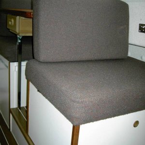 Barber chair on the Lynn Marie in the inovative TyBoo position. Cushion snaps onto bottom of table.