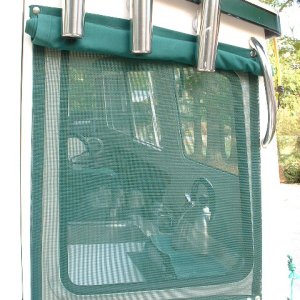 Mesh sun shade under the outer cover. These let light in but block a lot of the heat...like the ones you see on car windows. We also have one under the hatch opening in the berth.
