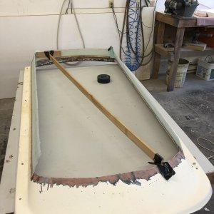 I used smooth 1/4" masonite to make forms (forgot to take pictures) for the new sidewalls and applied one intial layer of 1708 fiberglass ioregnated with West System 105 epoxy.