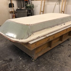 Done. Well, except for sanding and fairing. The new sections consist of two layers of 1708 with additional layers at the edges and corners. Note that while the roof section of this hightop is 4" higher like the factory high top, it is longer than the factory hightop, meaning the front angle is a steeper pitch. My reason for adding a hightop is to provide a place to store 30" x 64" thin flex solar panels, and the ceiling space in a standard factory high top is too short to allow this.