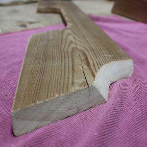 Raw front face of shelf with both angles cut out.  I used some 1X6 scrap redwood I had laying around in the garage.