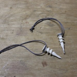 Plugs I used to keep unit in place after installation.  The cords will come in handy to help pull the plugs when I need to get to the anchor rode locker in the future.