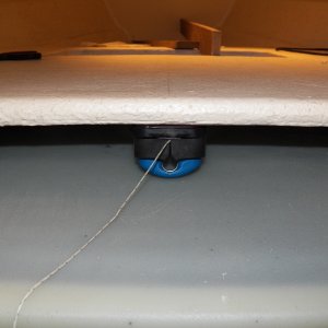 This is the cam cleat by the helm (again with a string instead of the anchor line).  A regular cleat will be off to the right so that the anchor rode isn't held by only a cam cleat.