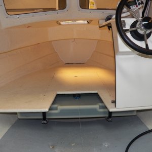 The original bow bulkhead was fastened top and bottom (deck and berth) with a couple rusty angle brackets.  I moved the bulkhead forward two inches and used caulking to glue the bulkhead to the hull on both sides.  Since the boat has no ribs, any bulkhead helps reduce hull noise.  Plus, now my berth is 6 foot 2 inches!!!
