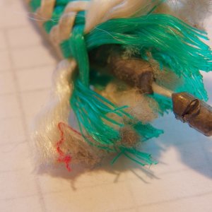 The secret is a string of lead beads down the center of the line.