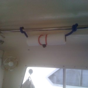 Don't know what to call this but I bought it at K-mart.  It is a very flexible rubber coated wire that allows twisting into numerous shapes.