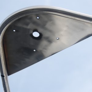 Sea Angel's searchlite S.S mounting plate for bow rail- port view just after welder finished. There is plenty of room to add a pennant staff, if I choose.