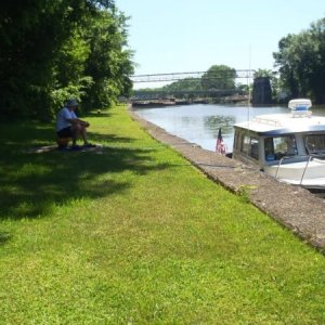 21.) Waiting at lock wall for barges to exit lock to go clear the tree.