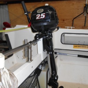 It slips in, without fasteners, and is left at home with the dinghy and motor when they aren't to be used.