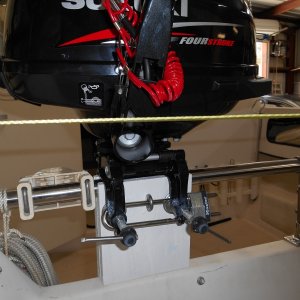 Lock passes through the eye bolt and motor bracket eyes to secure.