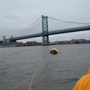(Minnow) The tough way to tow a boat, knife at the ready in case it looses air.