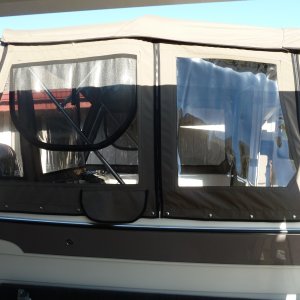 Side view showing smile windows with screens and extra panel forward to facilitate entry. Note: top panel can also be zipped to center.