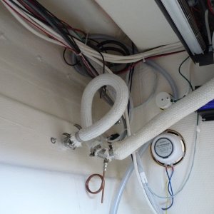 9. New exhaust installation with a coiled copper tube which leads to a collection bottle for any salt water that may get to this point.