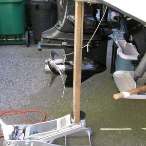 Media 'Floor jack.' in album 'Swim step removal.  The tools; a sharpened putty knife, nylon spatula,heat gun, rubber mallet, 2X6 & a floor jack.  You can see the step actually bending under the load but not budging.'