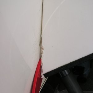 Media 'Pry tool inserted.' in album 'Swim step removal.  The tools; a sharpened putty knife, nylon spatula,heat gun, rubber mallet, 2X6 & a floor jack.  You can see the step actually bending under the load but not budging.'