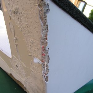 Media 'Some damage to the gelcoat.  Couldn't be avoided as this was the first side I started working on.  Better this than the hull.' in album 'Swim step removal.  The tools; a sharpened putty knife, nylon spatula,heat gun, rubber mallet, 2X6 & a floor jack.  You can see the step actually bending under the load but not budging.'