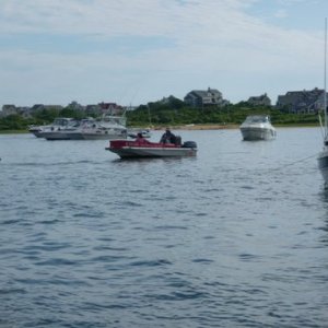 New Harbor in Block Island, this guy (Aldo) who bellows in  Italian,let's go and is selling pastries, breakfast sandwiches, bread all very good going boat to boat in the salt pond on Block Island. This place is packed for the fireworks on July 3rd. 1500 boats the town is packed great scenery of all kinds,I'm sitting on my boat loving life as I write this caption