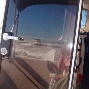 the reflection of Knot Flyin in my rear door