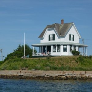 Anchored in Block Island in shallow water for the fire works which go off just of the right of the house.