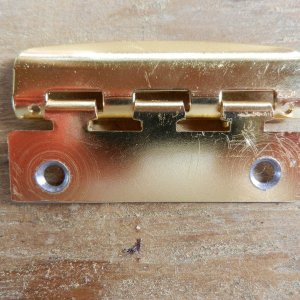 Cut mounting tab drilled with new countersunk holes