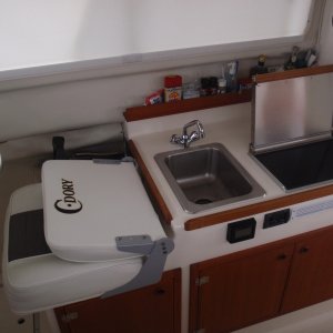 Media 'Galley - sink, Wallas diesel cooktop/heater w/small black control, Stbd interior window shade, Vessel Sys DC Monitor VSM 422 in front of sink' in album 'Galley - sink, Wallas diesel cooktop/heater w/small black control, Stbd interior window shade, Vessel Sys DC Monitor VSM 422 in front of sink'