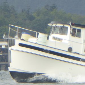 Notice the two 55-gallon barrels of water on the bow and "Test Boat" registration plate.