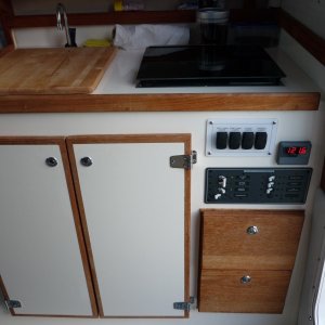 P1000485 standard 08 Venture Interior w std. butane stove, cutting board has starboard strips underneath that fit into the sink to keep it from sliding around while underway
