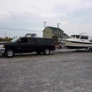 The new tow rig, 2009 2500 Chevy extended cab long bed with a Duramax Diesel and an Allison transmission weight 8100 pounds 17 to 11 mpg pulling boat mileage dependent on towing speed and tail or head wind.Boat and trailer 1/2 fuel 1/4 tank of water weighs 5540. Loaded for cruising 6000 pounds +