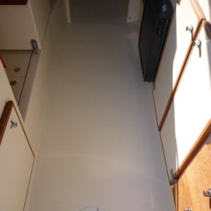 second one by the rear of cabin,laid a bead of marine silicone on the bottom of deck plate flange to seal used 10/32 stainless screws with nylon lock nuts to hold in in place