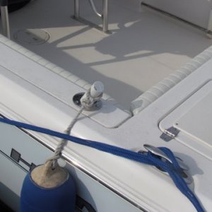 A closer view of the wooden dowel arrangement to hold boat bumpers