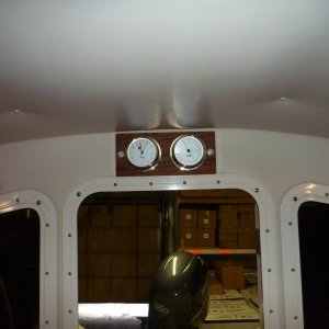 Clock and barometer on teak thru bolted