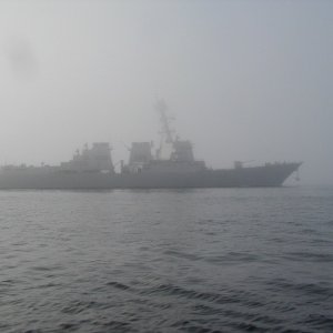 (C-Fisher)It was much closer then it looks in the photo, we could easily see the men standing on the bow.