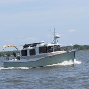 Mike and Jess Rizzo's Illusion a 27' Ranger Tug,this boat is fully equipped,flat screen, freezer refridge,A.C. Webasco heater,a full compliment of electronics,busts thru 3 footers like it was warm butter