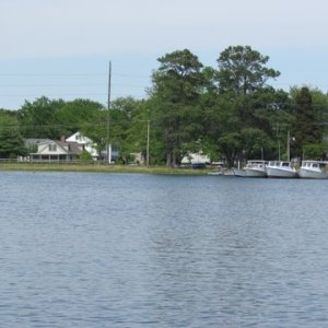 Media 'Backside of St. Michaels by way of the San Domingo Creek anchored here took dinks to the town dink dock located to the left of the work boats, beautiful here.' in album 'Our take off point Duffy's Creek Marina,on the Sassafras river 8 miles off the Cheaspeake Bay Fredricktown, Md. Excellent deep water launch ramp,fee 12 dollars, rig parking 6.00 dollars per day, trancient slip 1.75 per foot. all amenities including pool launch, showers fuel dock with gas and diesel. If you look carefully you can see a 22 C-Dory Cruiser Salt-C  just to the rear and left of the launch ramp area.'