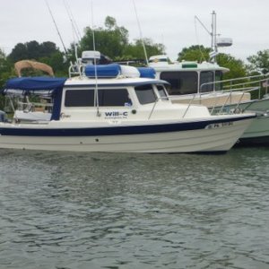 Loaded for cruising,dink in the cockpit along with cooler dink motor, barbecue up on the radar arch, full of fuel and water. Lot's of fixed docks with pilings, some make up a fender board made out of 5'or 6' PVC pipe with a line out of both ends so the PVC pipe hangs outside of the bumpers and is against the pilings. I use big bumpers with a line running thru it and knots on either side of the bumper to prevent it from sliding on the line. I tie the line off at both ends to the roof's grab rail and keep the bumper horizontal centered on the piling
