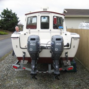 Looking it over, view of twin 40 Yamaha's and trim tabs.