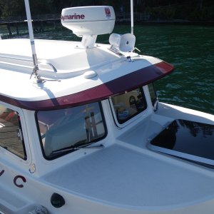 Media 'SleepyC external electronics array.  GPS down off the post and onto the brow, the hailer horn glued on, 2 VHF antennas work for 2 VHF's, with AIS receiver and AM/FM too. Forward hatch is up at first notch.  Gets lowered and locked down anytime I go out of Sequim Bay, or out into open water.' in album 'Jim's Dorie comes to NineVista and begins the transformation to Sleepy C'